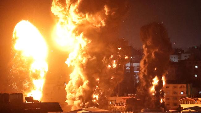 Fire and smoke rise above buildings in Gaza City as Israeli warplanes target the Palestinian enclave. Picture: AFP.