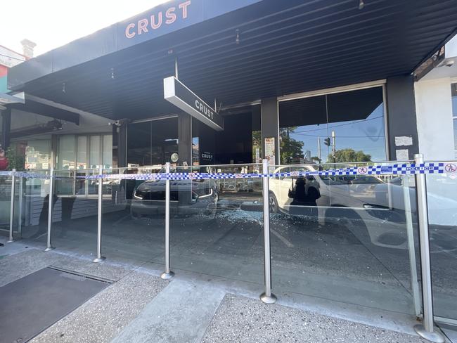 Police were told the front door was smashed by multiple offenders before the store was set alight. Picture: Himangi Singh