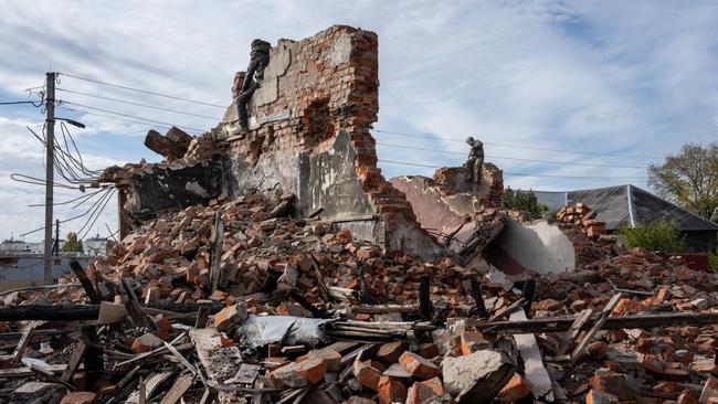 Builders work to demolish the remains of a house destroyed by a Russian missile, on Wednesday in Kharkiv, northeast Ukraine. Picture: Getty Images