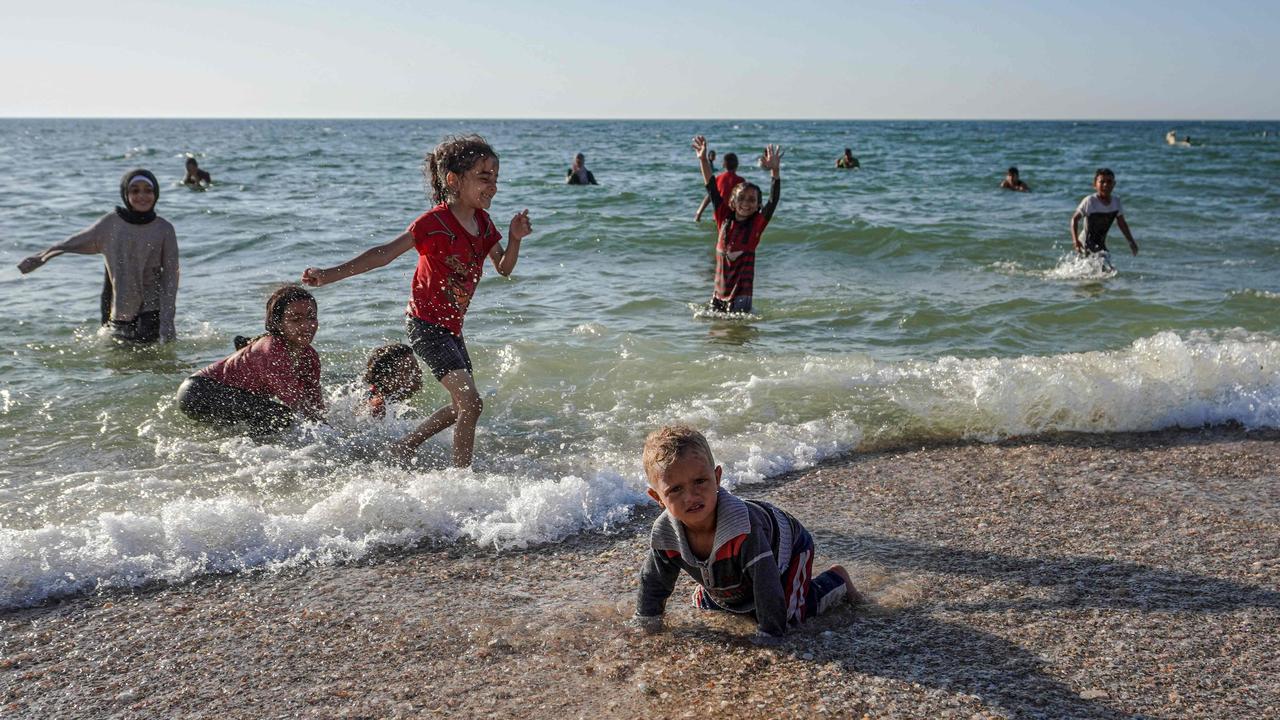 Palestinian children play on a beach in Deir el-Balah in the central Gaza Strip. Picture: AFP