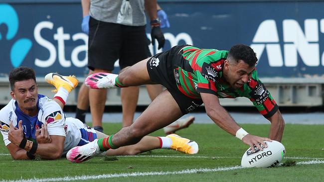 Souths winger Alex Johnston scores his second try against Newcastle. Picture: Brett Costello