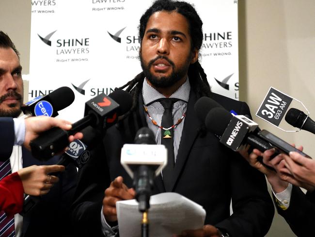 Joel Wilkinson Former AFL player suing for racial vilification and sexual harassment makes a statement to the media with Will Barsby employment law expert from Shine Lawyers.  Picture: Nicole Garmston