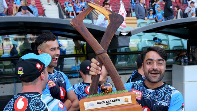 TROPHY WINNERS: Star Adelaide Strikers leg-spinner Rashid Khan poses with the Jason Gillespie Trophy that the team claimed in BBL08. Picture: JASON McCAWALEY (Getty Images).