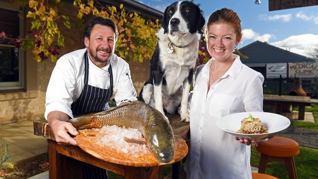 Olfactory Inn's Simon Burr, partner Lauren Alexander and dog Edie with fresh carp, one of their unconventional menu hits. Picture: Tom Huntley