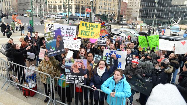 People cheer as singer Kesha is seen arriving at New York State Supreme Court in February. The singer was fighting to be voluntarily released from her contract with Sony.