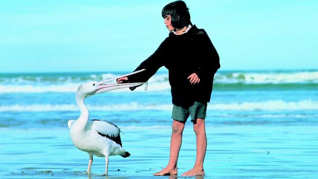 Actor Greg Rowe and a pelican in a scene from 1976 movie Storm Boy.