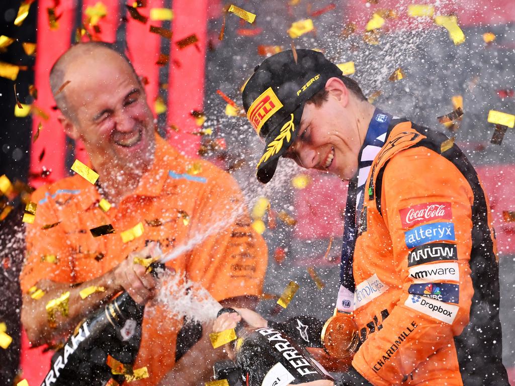 BAKU, AZERBAIJAN - SEPTEMBER 15: Race winner Oscar Piastri of Australia and McLaren and McLaren race engineer Tom Stallard celebrate on the podium during the F1 Grand Prix of Azerbaijan at Baku City Circuit on September 15, 2024 in Baku, Azerbaijan. (Photo by Dan Mullan/Getty Images) *** BESTPIX ***