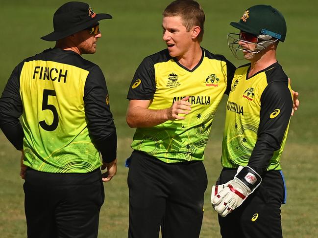 DUBAI, UNITED ARAB EMIRATES - NOVEMBER 04: Adam Zampa of Australia celebrates the wicket of Afif Hossain of Bangladesh with team mates Aaron Finch and Matthew Wade during the ICC Men's T20 World Cup match between Australia and Bangladesh at Dubai International Stadium on November 04, 2021 in Dubai, United Arab Emirates. (Photo by Alex Davidson/Getty Images)