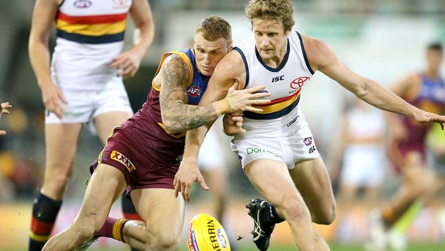 Crows star Rory Sloane competes against Lion Mitch Robinson on Saturday. Picture: AAP Image/Jono Searle