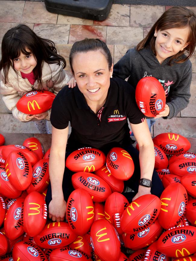 Daisy Pearce with two aspiring fans. Picture: Andrew Tauber