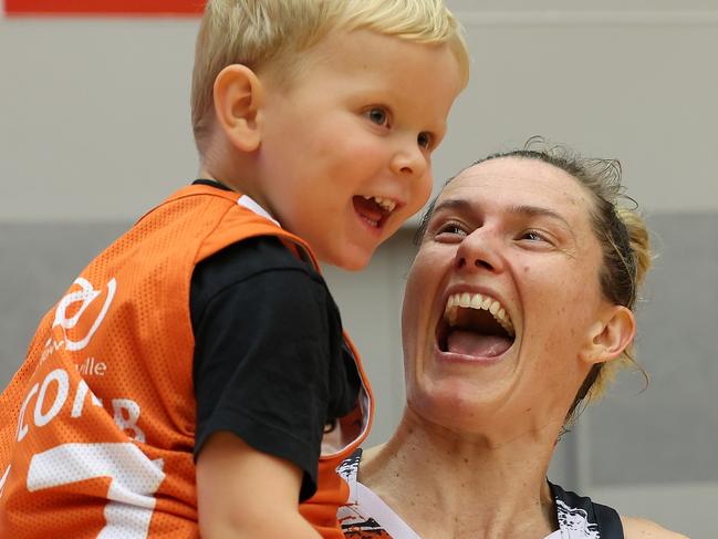 PERTH, AUSTRALIA - NOVEMBER 25: Sami Whitcomb of the Fire celebrates with her son Nash after winning the WNBL match between Perth Lynx and Townsville Fire at Bendat Basketball Stadium, on November 25, 2023, in Perth, Australia. (Photo by Paul Kane/Getty Images)