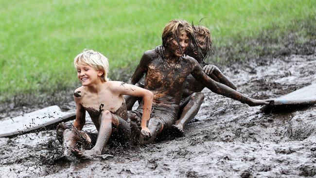 Wet weather - Flooding on the Gold Coast. Burleigh Heads locals made the most off their day off school at Miami Hill. Picture: NIGEL HALLETT