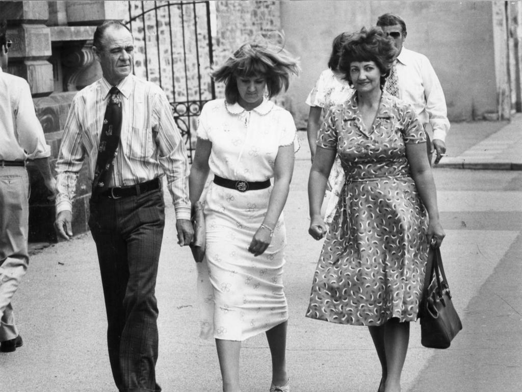 Ray and Rhonda Lamb, parents of Deborah Anne Lamb, leave court with one of their daughters after Mrs Lamb gave evidence on February 21, 1980.