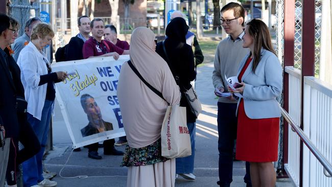 Bankstown MP Tania Mihailuk and Roydon Ng hand out flyers protesting the Metro plans to commuters at Regents Park station last year. Picture: Simon Bullard