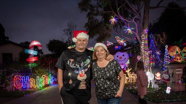 Kym and Sue Briggs have brought Xmas cheer to their Shadow Park community with lights for over 30 years. Picture: Emma Brasier