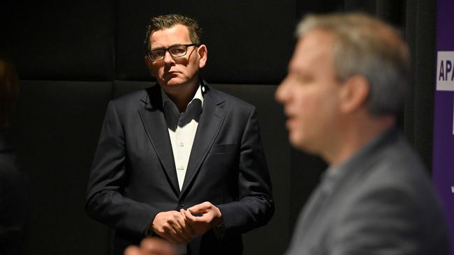 Victorian Premier Daniel Andrews. left, listens as state Chief Health Officer Brett Sutton addresses today’s media conference. Picture: William West/AFP