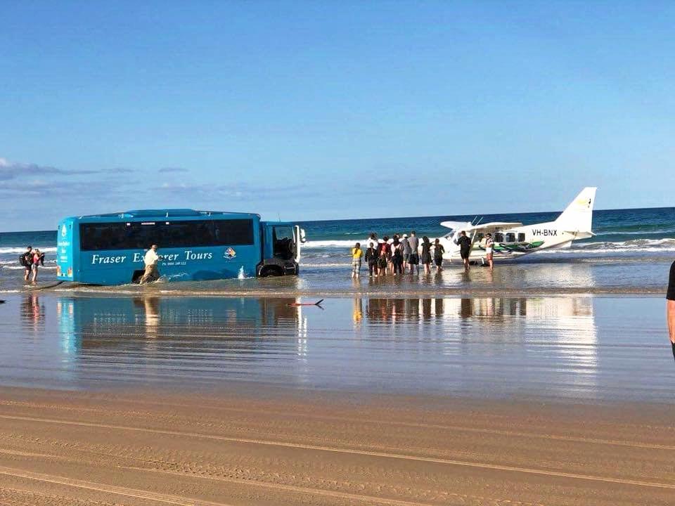 The Central Queensland Plane Spotting Blog has shared photos of a bus attempting to rescue the Air Fraser Island Airvan ahead of high tide. Picture: CQ Plane Spotting Blog