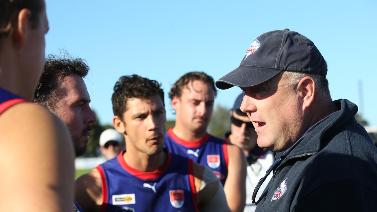 Queenscliff coach Heath Jamieson speaks to his charges at quarter time against Geelong Amateur. Picture: Alan Barber