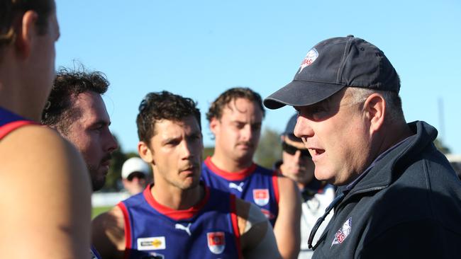 Queenscliff coach Heath Jamieson speaks to his charges at quarter time against Geelong Amateur. Picture: Alan Barber