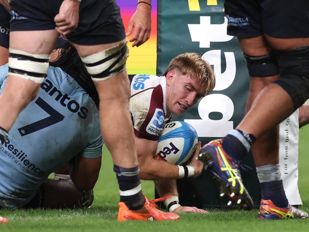 Tate McDermott scores a crucial try for the Queensland Reds. Picture: Getty Images