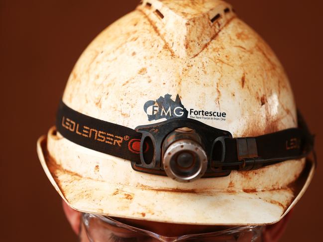 A headlight is worn over a miner's helmet at Fortescue Metals Group Ltd.'s Herb Elliott port facility in Port Hedland, Australia, on Wednesday, Oct. 26, 2016. Shares in Fortescue, the world's No. 4 iron ore exporter, have almost trebled in 2016 as iron ore recovered, and the company cut costs and repaid debt. Photographer: Brendon Thorne/Bloomberg