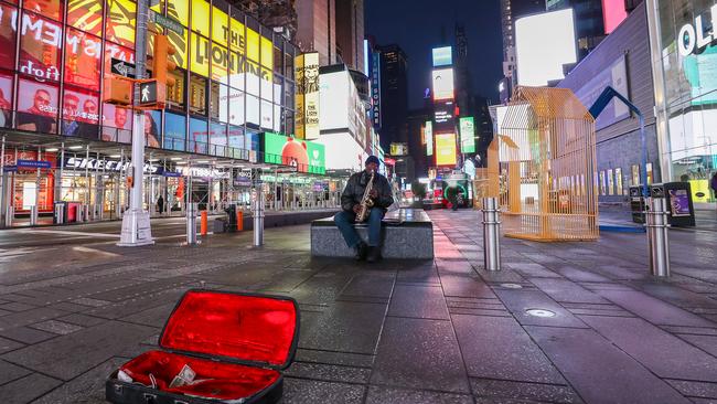 A lone saxophonist in a deserted Times Square in April, 2020, as the pandemic gripped New York City. Picture: Arturo Holmes/Getty Images