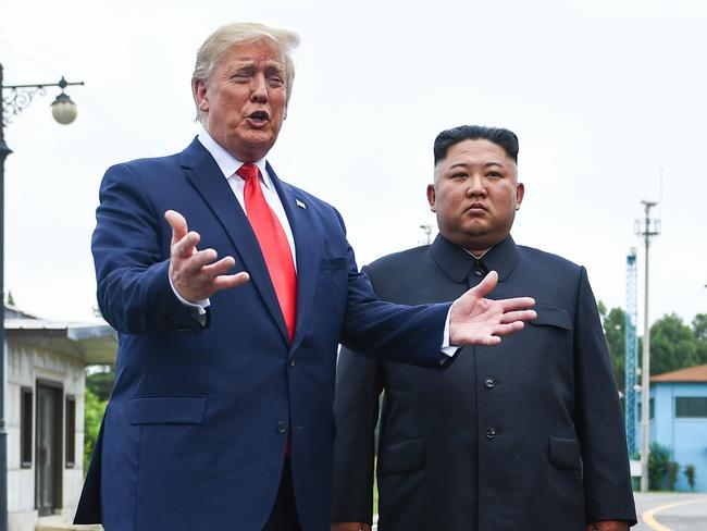 US President Donald Trump speaks as he stands with North Korea's leader Kim Jong Un south of the Military Demarcation Line that divides North and South Korea, in the Joint Security Area (JSA) of Panmunjom in the Demilitarized zone (DMZ) on June 30, 2019. (Photo by Brendan Smialowski / AFP)
