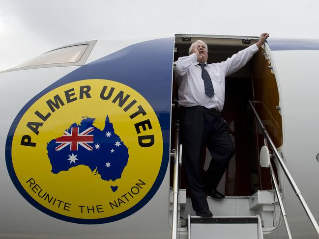 Palmer United Party (PUP) leader Clive Palmer yells in frustration from his aircraft toward Prime Minister Kevin Rudd's personnel in a nearby hanger after Mr Palmer's plane had been refused refuelling by Air BP refuellers at Melbourne Airport, Thursday, Aug. 29, 2013. (AAP Image/Dave Hunt) NO ARCHIVING