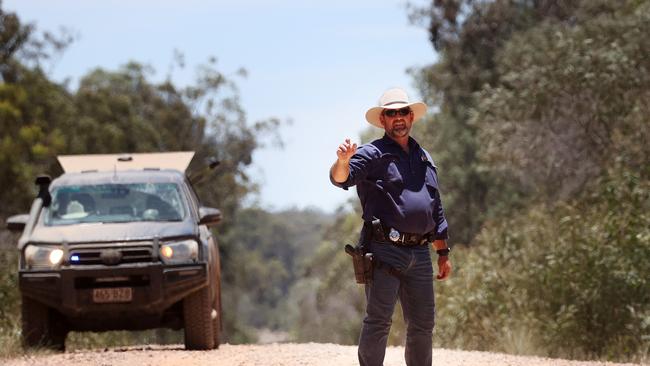 Police block the unsealed Wains Rd at Wieambilla earlier this week. Picture: Liam Kidston