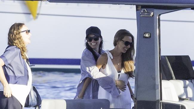 Erica Packer enjoys the company of friends on Sydney Harbour on a luxury vessel over Easter. She left for Los Angeles on Friday. Picture: Instar