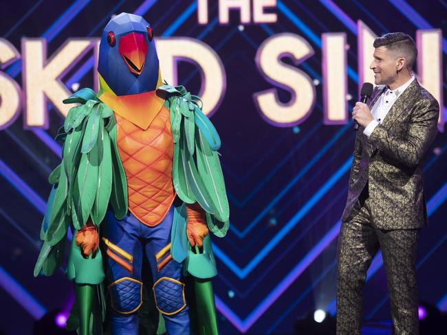 Brett Lee before he takes off his parrot head on The Masked Singer. Picture: TEN