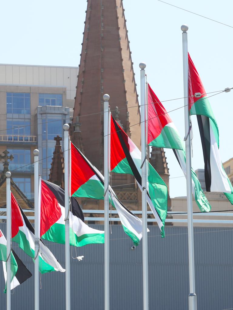 Some Israel community spokespeople are calling on Federation Square management to take the flags down. Picture: David Crosling