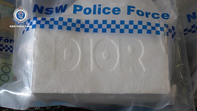 A block of Dior-imprinted cocaine seized by police during raids. Picture: NSW Police