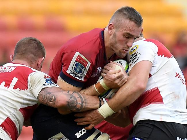 BRISBANE, AUSTRALIA - APRIL 28:  Izack Rodda of the Reds takes on the defence during the round 11 Super Rugby match between the Queensland Reds and the Lions at Suncorp Stadium on April 28, 2018 in Brisbane, Australia.  (Photo by Bradley Kanaris/Getty Images)