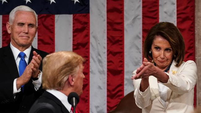 Donald Trump arrives to deliver the State of the Union address, alongside Speaker of the House Nancy Pelosi and Vice President Mike Pence in February, 2019.