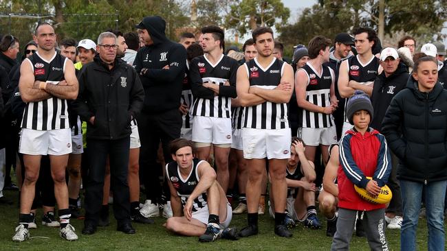 Moonee Valley players and supporters after the club’s grand final defeat. Picture: Mark Dadswell