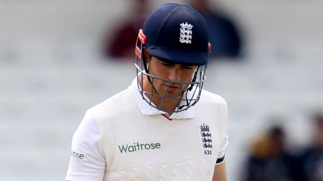England's Alastair Cook wearing the “compliant protective headgear”.