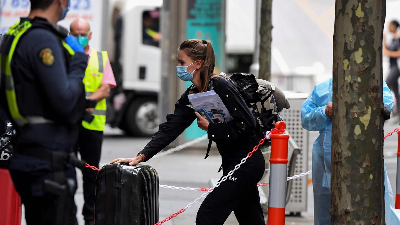 Tennis players, coaches and officials arrive at a hotel in Melbourne on January 15 before quarantining for two weeks ahead of the Open. Picture: William West/AFP