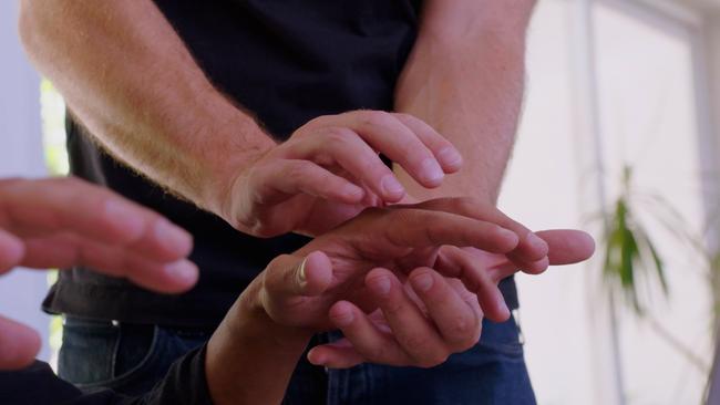 Goldsmith focuses his energy on the hands of a patient. Picture: Foxtel/TLC