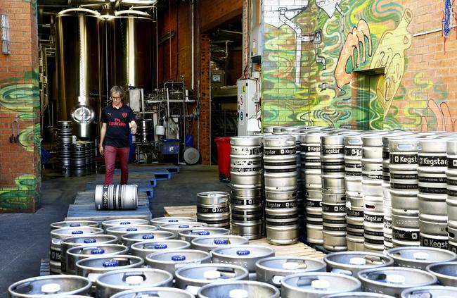 Brewer Oscar Clifford-Smith rolls out another full keg. Picture: John Appleyard