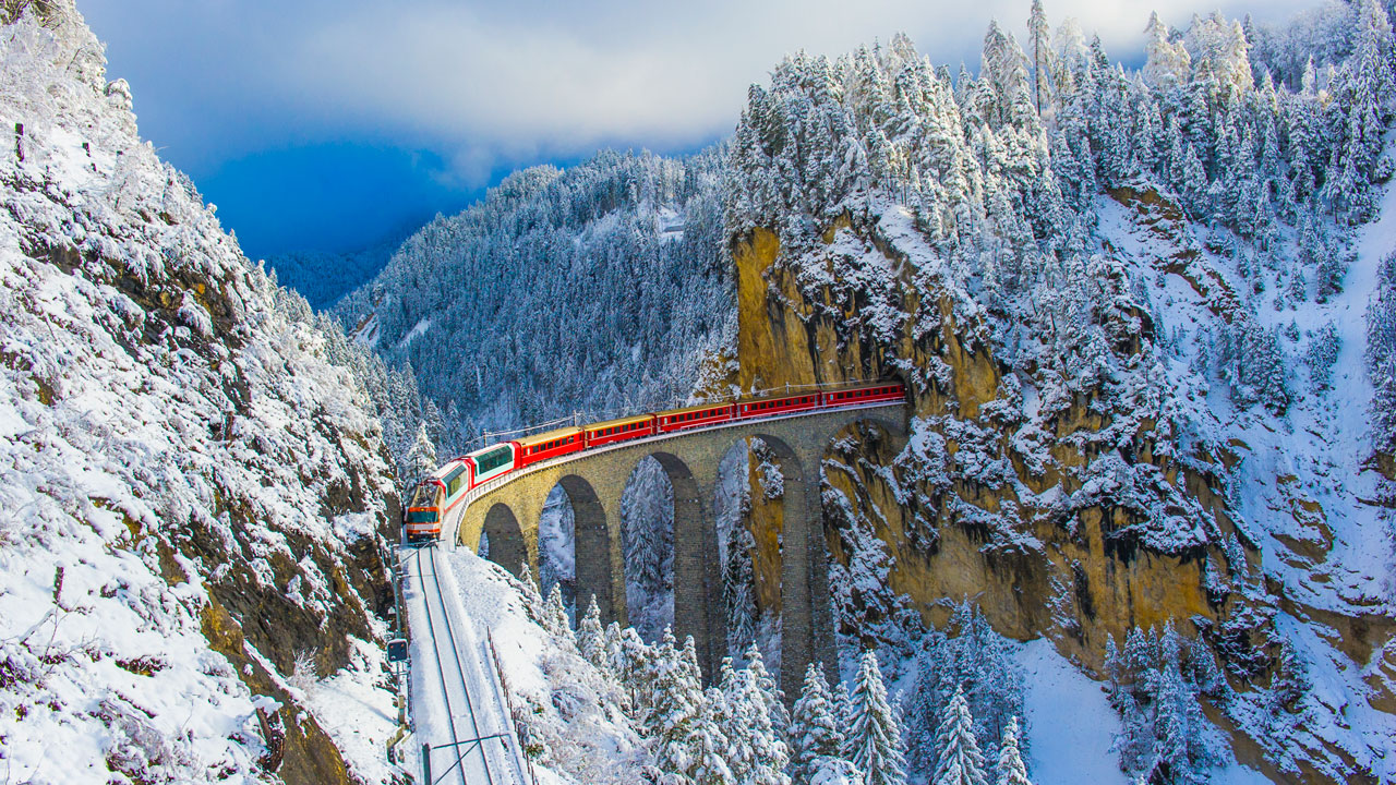 <h2 class="h2style"><strong>3. The Bernina Express, Switzerland/Italy</strong></h2><p><span><a href="https://www.myswitzerland.com/en-au/experiences/bernina-express/" target="_blank" rel="noopener">The Bernina Express</a> is one of the most famous rail journeys in the world, zooming through 55 tunnels and chugging over 196 bridges on its way from Chur/St Moritz in Switzerland to Tirano, Italy (or vice versa), taking passengers on a stunning 144km journey over the alps. Highlights of the trip include stunning views over the Bernina mountains, the Morteratsch glacier, the Alp Gr&uuml;m, the Brusio Circular Viaduct and the three lakes Lej Pitschen, Lej Nair and Lago Bianco. What makes it most famous though is the moment you roll over the 65-metre-high Landwasser Viaduct, the signature structure of the Rhaetian Railway and a UNESCO World Heritage site.&nbsp;</span></p><p>Average journey time: 4.5 hours</p><p>Price: I<span>f you already have </span>a Swiss Travel Pass or Swiss Travel Pass Flex you just need to pay a reservation fee of A $60. If not, it's more like<span> A $174 for a Saver Day Pass + reservations. For more information on pricing head to <a href="https://www.myswissalps.com/activity/bernina-express/" target="_blank" rel="noopener">My Swiss Alps</a>.&nbsp;</span></p>