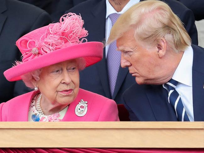 (FILES) In this file photo taken on June 5, 2019 Britain's Queen Elizabeth II (L) reacts as she sits with US President Donald Trump an event to commemorate the 75th anniversary of the D-Day landings, in Portsmouth, southern England. - Queen Elizabeth II, the longest-serving monarch in British history and an icon instantly recognisable to billions of people around the world, has died aged 96, Buckingham Palace said on September 8, 2022. Her eldest son, Charles, 73, succeeds as king immediately, according to centuries of protocol, beginning a new, less certain chapter for the royal family after the queen's record-breaking 70-year reign. (Photo by Chris Jackson / POOL / AFP)