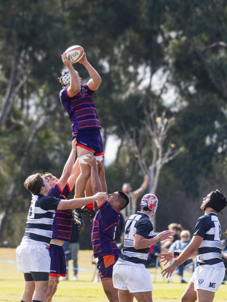 Sam Human gets possession for Sunshine Coast against Met East.