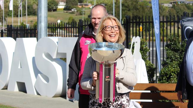 CHCC Mayor Denise Knight holds up the Big Bash League trophy while flanked by  Cricket NSW Northern NSW area manager, Martin Garoni.