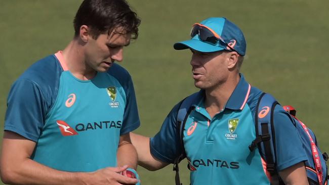 Captain Pat Cummins and his teammate David Warner deep in conversation as the Aussies hope to turn around their poor start to the tour.