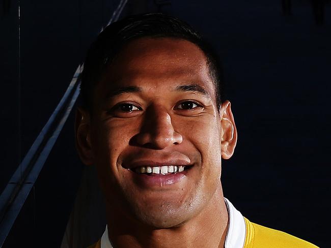 Israel Folau of the Australian Wallabies rugby team poses for a photo with the Sydney Opera House in the background during the 2014 Wallabies rugby jersey launch at the Park Hyatt hotel in Sydney. Pic Brett Costello