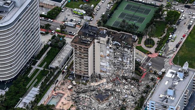 This aerial view, shows search and rescue personnel working on site after the partial collapse of the Champlain Towers South in Surfside, north of Miami Beach.