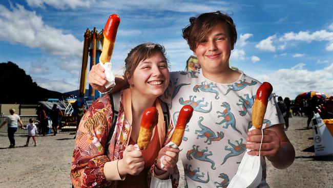 Siblings Isabel Grotaers and Abijah Grotaers 15 from Bridgewater with dagwood dogs. Hobart Show 2021 day 1. Picture: Nikki Davis-Jones