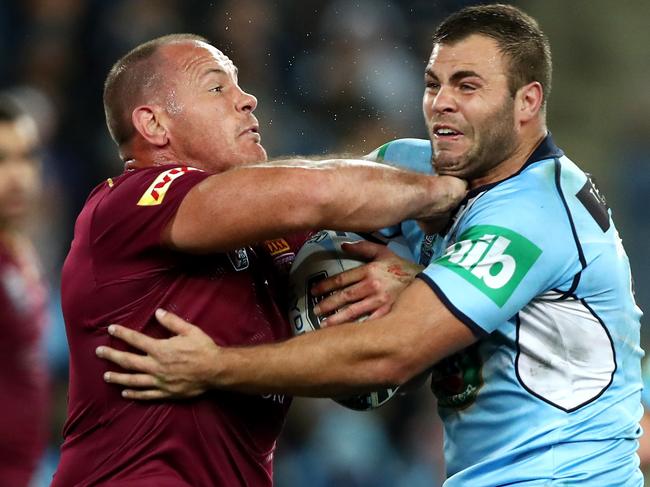 QLD's Matt Scott tackled by NSW's Wade Graham during game 3 of the 2016 Origin series between the NSW Blues and the Queensland Maroons at ANZ Stadium , Homebush .Picture : Gregg Porteous