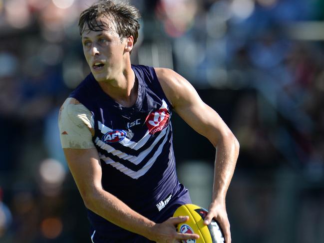 SPORT - NAB Challenge, Fremantle Dockers vs Richmond Tigers, Bendigo Bank Stadium, Mandurah. Photo by Daniel Wilkins. PICTURED- Fremantle's Cameron Sutcliffe gathers the ball in the middle